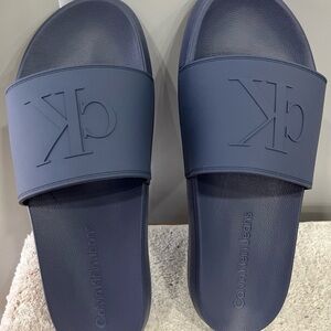Calvin Klein Medium Gray Embossed CK Slide Sandals